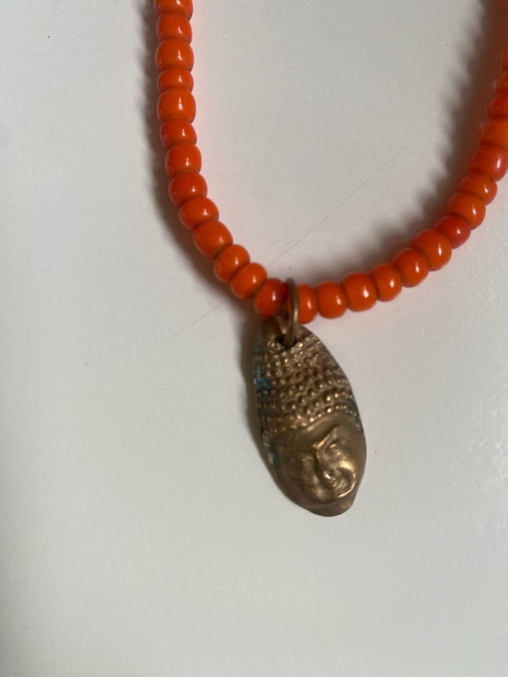 Orange Beaded Necklace with  Buddha Pendant